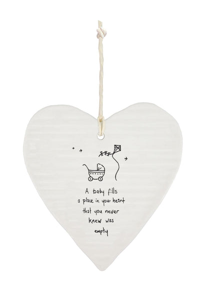 East Of India A Baby Fills Your Heart Wobbly Heart Shaped Ceramic Hanging Plaque